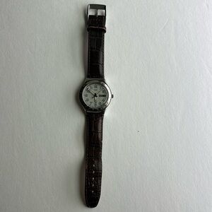 Swatch watch w leather band. Day & date display.